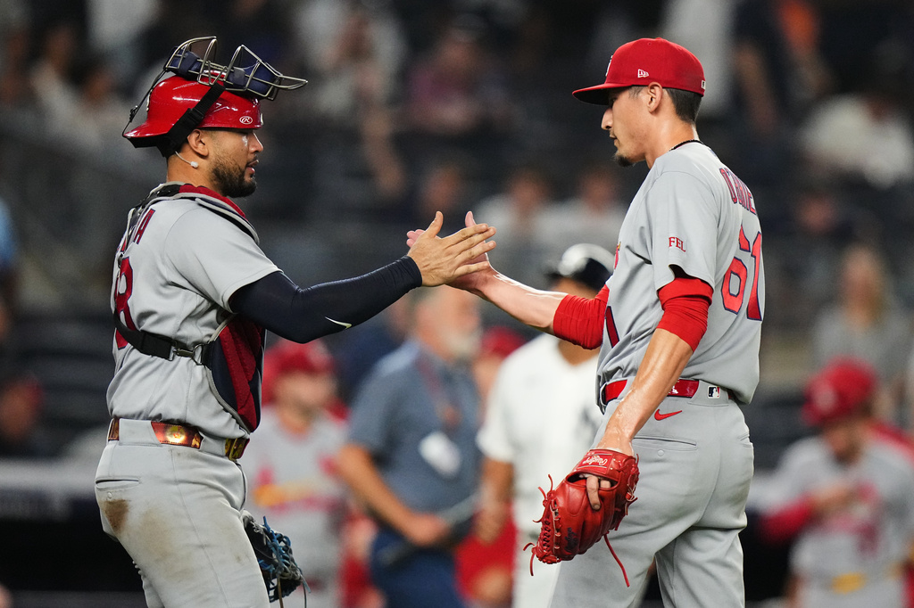 St. Louis Cardinals designated hitter Iván Herrera, left, celebrates with pitcher Riley O'Brien (61) after a baseball game against the New York Yankees Wednesday, Aug. 5, 2026, in New York. (AP Photo/Frank Franklin II)
