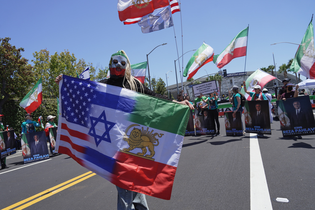 People protest outside Los Angeles Stadium before the World Cup Group G soccer match between Iran and New Zealand in Inglewood, Calif., near Los Angeles, Monday, June 15, 2026 (AP Photo/Ty ONeil)