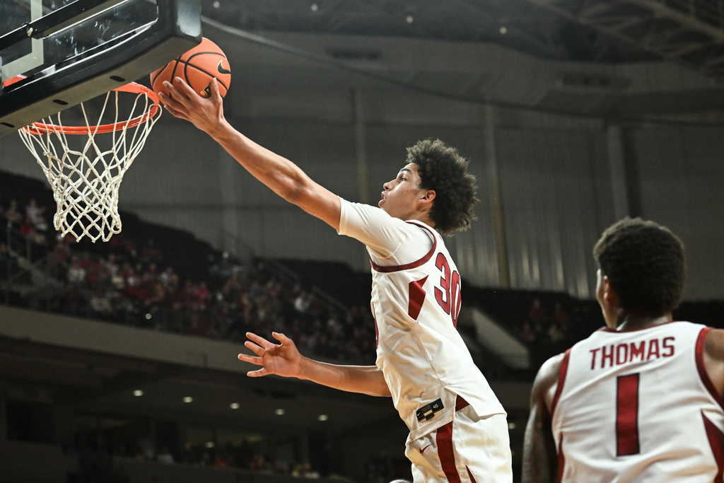 Arkansas guard Isaiah Sealy (30) makes a layup on a fast break against Fresno State during the second half of an NCAA college basketball game Saturday, Dec. 6, 2025, in North Little Rock, Ark. (AP Photo/Michael Woods)