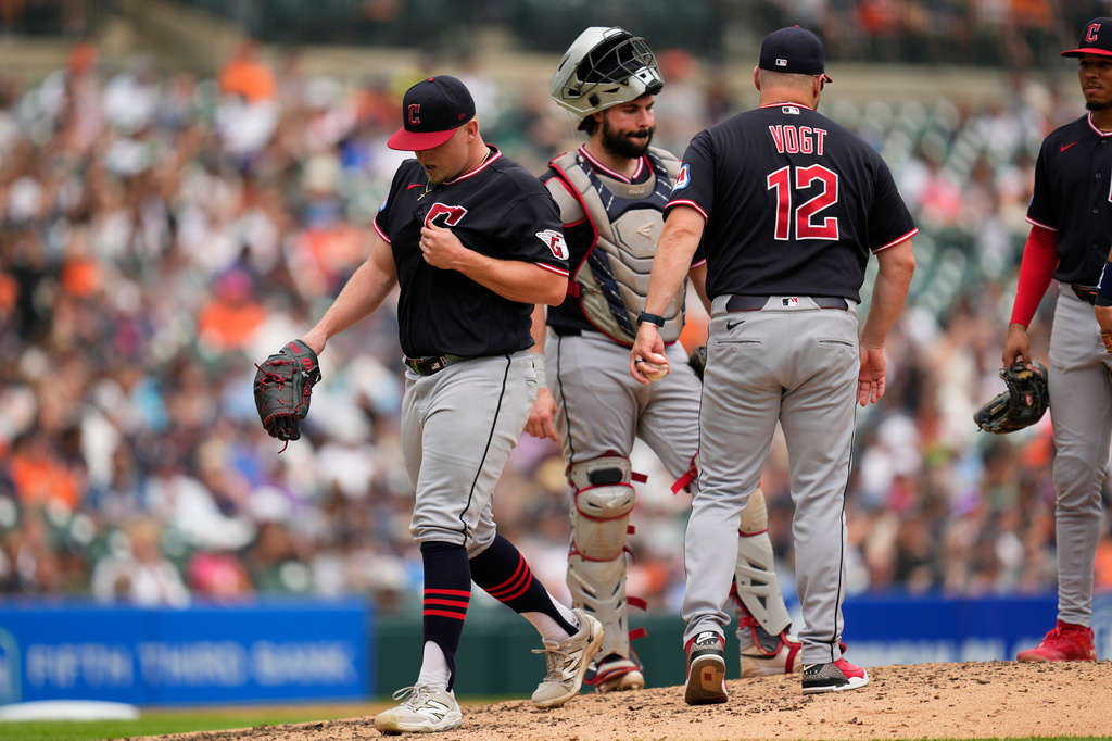 Cleveland Guardians manager Stephen Vogt (12) takes the ball from pitcher Parker Messick, left, against the Detroit Tigers during the sixth inning of a baseball game Thursday, Aug. 13, 2026, in Detroit. (AP Photo/Paul Sancya)