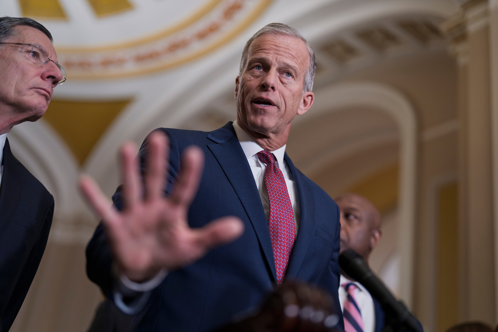 Senate Majority Leader John Thune, R-S.D., center, joined at left by Sen. John Barrasso, R-Wyo., the GOP whip, speaks to reporters at the Capitol in Washington, Tuesday, March 3, 2026. (AP Photo/J. Scott Applewhite)