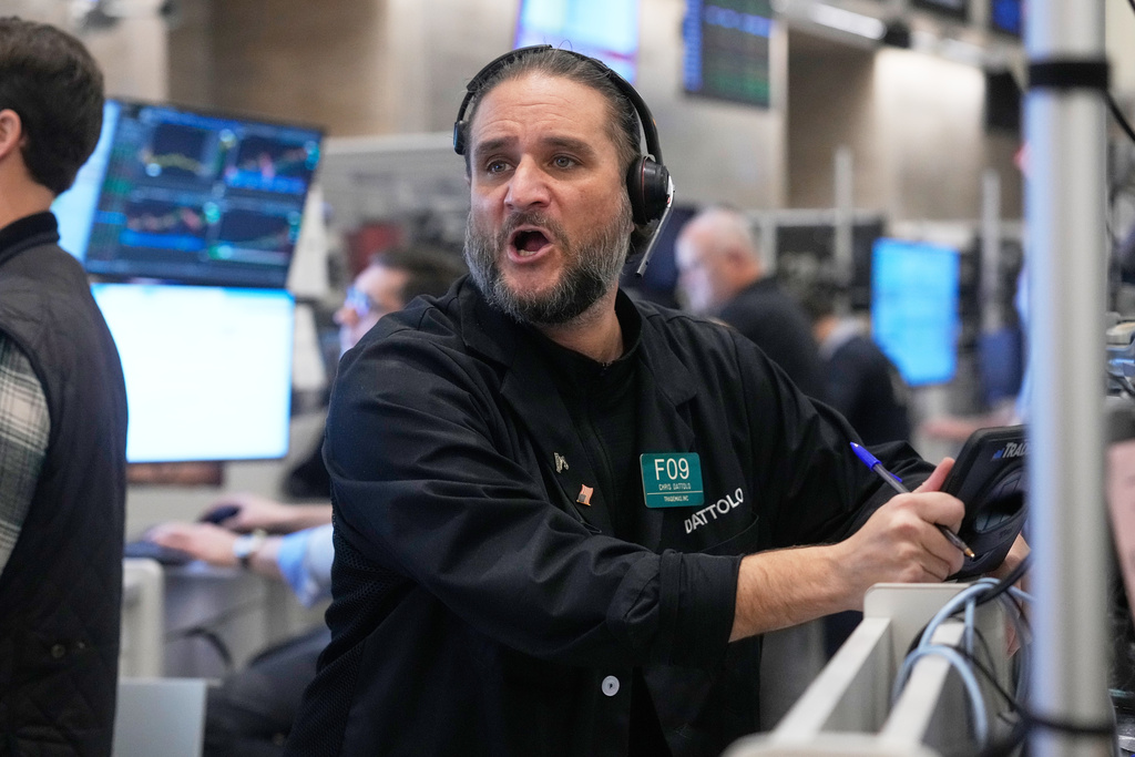 Options trader Chris Dattolo works on the floor of the New York Stock Exchange, Wednesday, Nov. 12, 2025. (AP Photo/Richard Drew)
