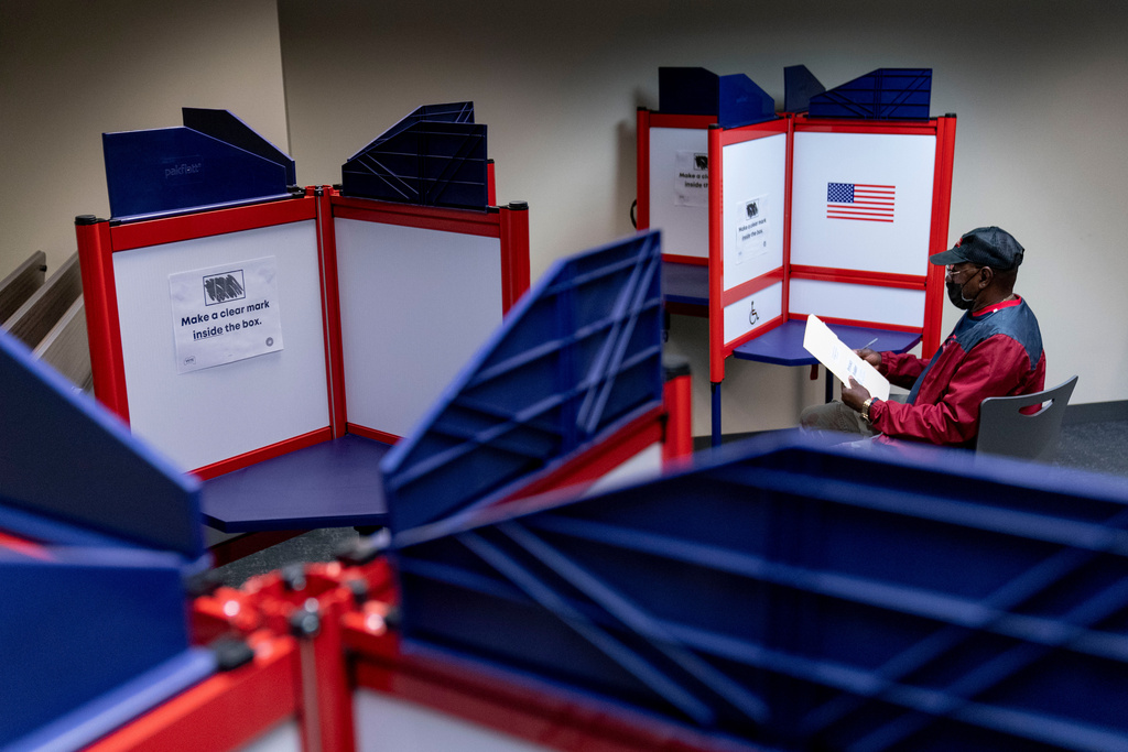 FILE - Cornelius Whiting fills out his ballot at an early voting location in Alexandria, Va., Sept. 26, 2022. (AP Photo/Andrew Harnik, File)