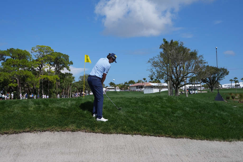 Nico Echavarria hits from the rough on the first green during the final round of the Cognizant Classic golf tournament, Sunday, March 1, 2026, in Palm Beach Gardens, Fla. (AP Photo/Marta Lavandier)