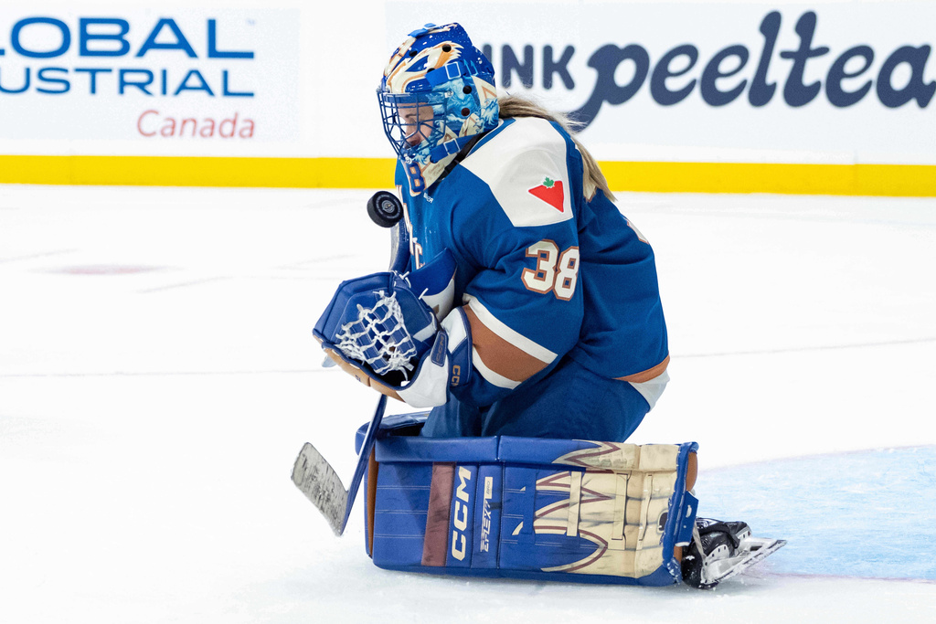 Vancouver Goldeneyess goaltender Emerance Maschmeyer stops the puck against the New York Sirens during the second period of a PWHL hockey game in Vancouver, British Columbia, Saturday, Dec. 6, 2025. (Ethan Cairns/The Canadian Press via AP)