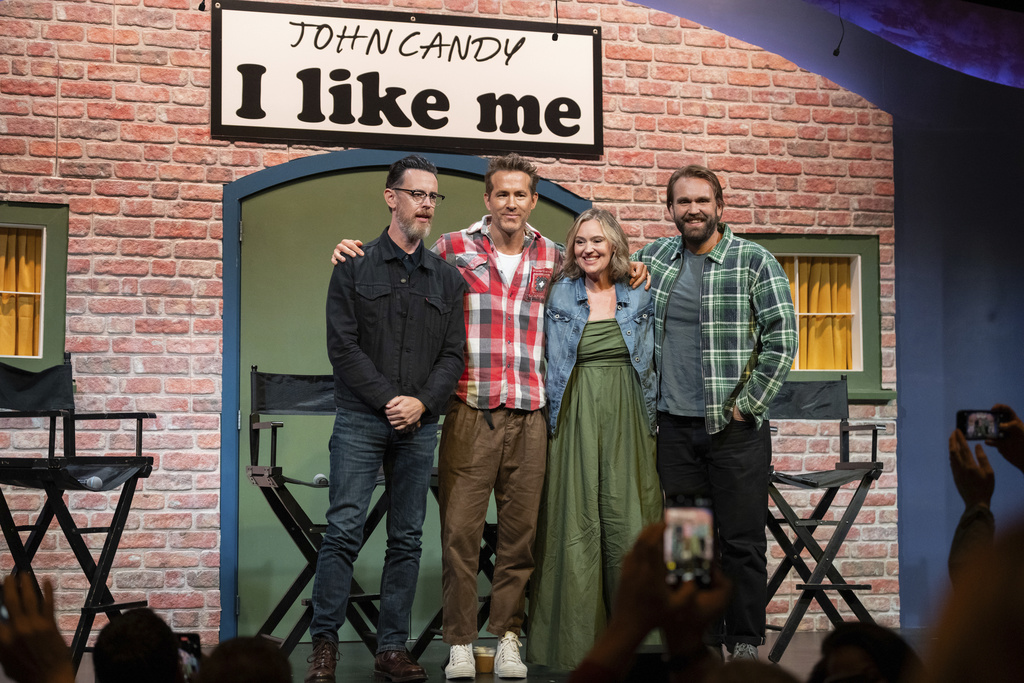 Director Colin Hanks, producer Ryan Reynolds, and John Candy's children Jennifer and Christopher Candy pose for a photo at a press conference for the film John Candy: I Like Me, prior to the film's premiere, at the Toronto International Film Festival, in Toronto on Thursday, September 4, 2025. (Arlyn McAdorey/The Canadian Press via AP)