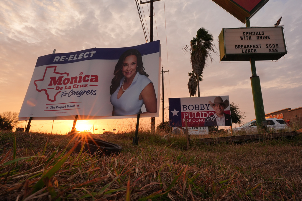 Campaign signs for Rep. Monica De La Cruz, R-Texas, and Democratic candidate for congress Bobby Pulido are posted in Edinburg, Texas, Tuesday, Feb. 10, 2026. (AP Photo/Eric Gay)
