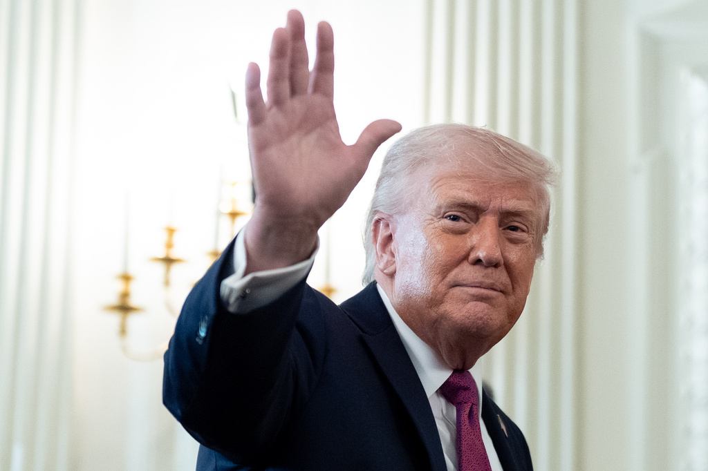 President Donald Trump waves as he departs after an event for NCAA national champions in the State Dining Room of the White House, Tuesday, April 21, 2026, in Washington. (AP Photo/Alex Brandon)