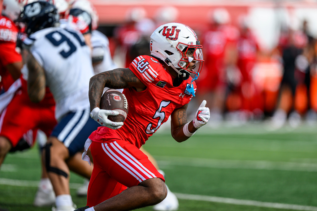 Utah running back Daniel Bray (5) runs the ball during the second half of an NCAA college football game against Utah State in Salt Lake City, Saturday, Sept. 19, 2026. (AP Photo/Tyler Tate)