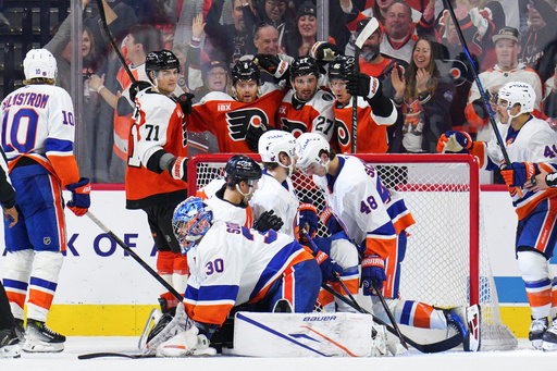 Philadelphia Flyers' Trevor Zegras (46) celebrates his goal with teammates past New York Islanders goaltender Ilya Sorokin (30) during the third period of an NHL hockey game, Saturday, Oct. 25, 2025, in Philadelphia. (AP Photo/Derik Hamilton) Philadelphia Flyers' Trevor Zegras (46) celebrates his goal with teammates past New York Islanders goaltender Ilya Sorokin (30) during the third period of an NHL hockey game, Saturday, Oct. 25, 2025, in Philadelphia. (AP Photo/Derik Hamilton)