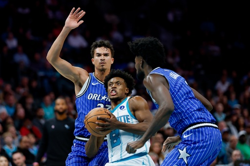Charlotte Hornets guard Collin Sexton (8) drives to the basket between Orlando Magic forwards Tristan da Silva, left, and Jonathan Isaac, right, during the first half of an NBA basketball game in Charlotte, N.C., Thursday, Oct. 30, 2025. (AP Photo/Nell Redmond) Charlotte Hornets guard Collin Sexton (8) drives to the basket between Orlando Magic forwards Tristan da Silva, left, and Jonathan Isaac, right, during the first half of an NBA basketball game in Charlotte, N.C., Thursday, Oct. 30, 2025. (AP Photo/Nell Redmond)