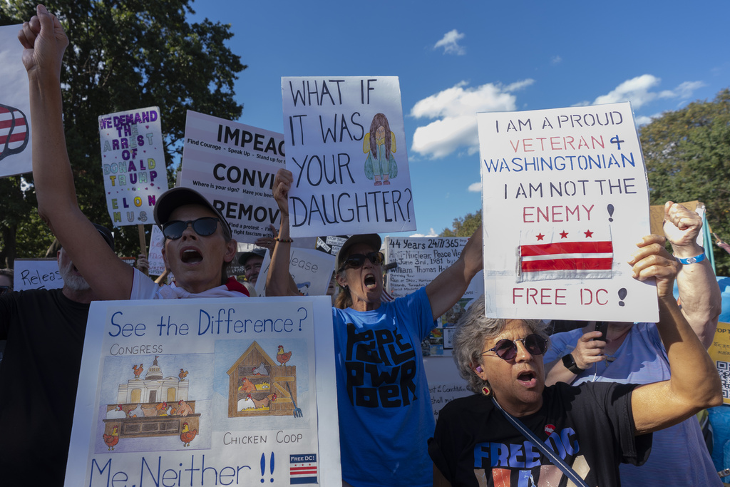 Demonstrators protest against President Donald Trump's use of federal law enforcement and National Guard troops in the city at the White House Tuesday, Sept. 2, 2025, in Washington. (AP Photo/Manuel Balce Ceneta)