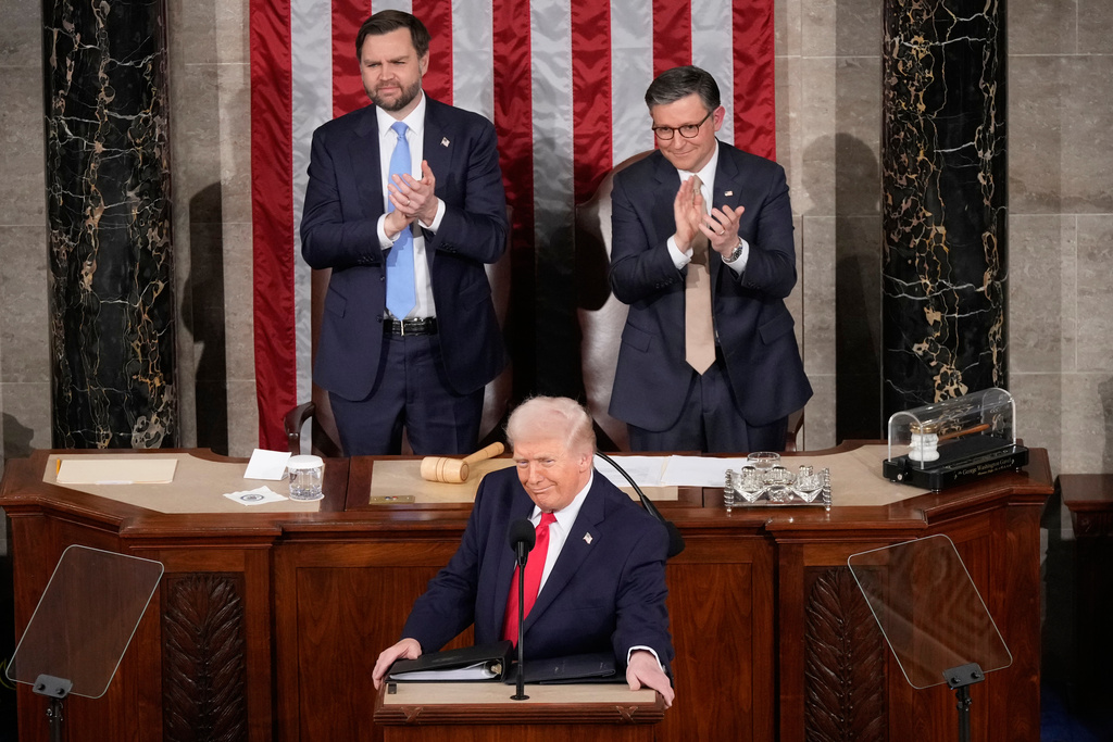 President Donald Trump delivers the State of the Union address to a joint session of Congress in the House chamber at the U.S. Capitol in Washington, Tuesday, Feb. 24, 2026, as Vice President JD Vance and House Speaker Mike Johnson of La., applaud. (AP Photo/Mark Schiefelbein)