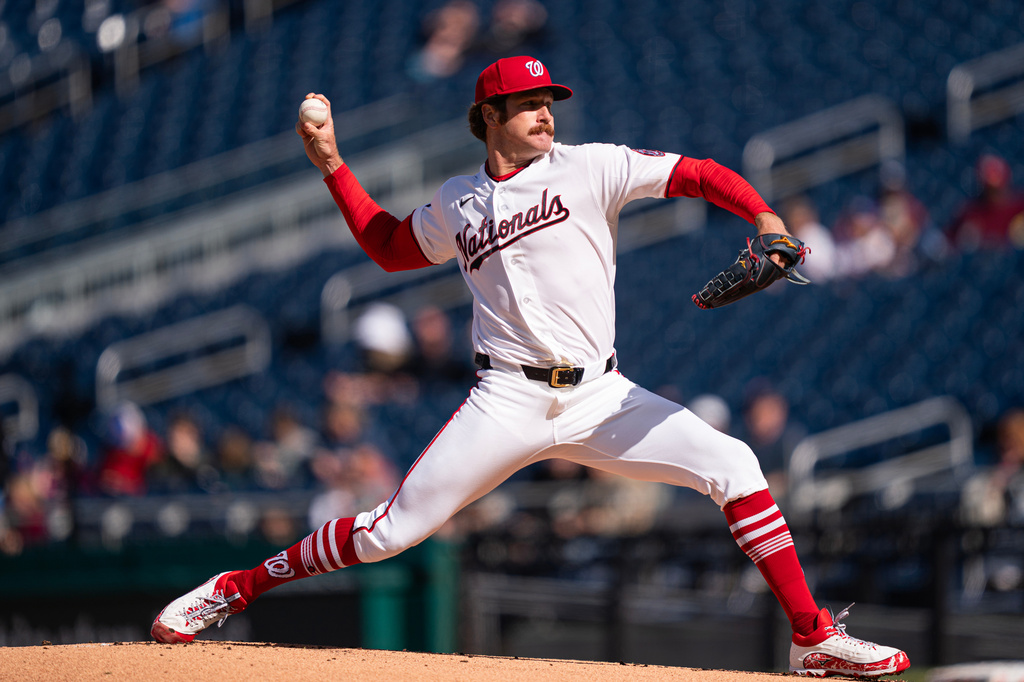 Washington Nationals pitcher Miles Mikolas pitches against the St. Louis Cardinals during the first inning of a baseball game, Wednesday, April 8, 2026, in Washington. (AP Photo/Nathan Howard)