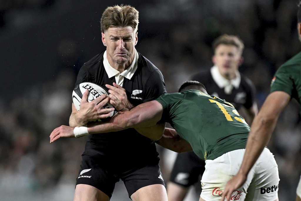 Jordie Barrett of New Zealand run sat the defence during their rugby international against the Springboks at Eden Park in Auckland, New Zealand, Saturday, Sept. 6, 2025. (Andrew Cornaga/Photosport via AP)
