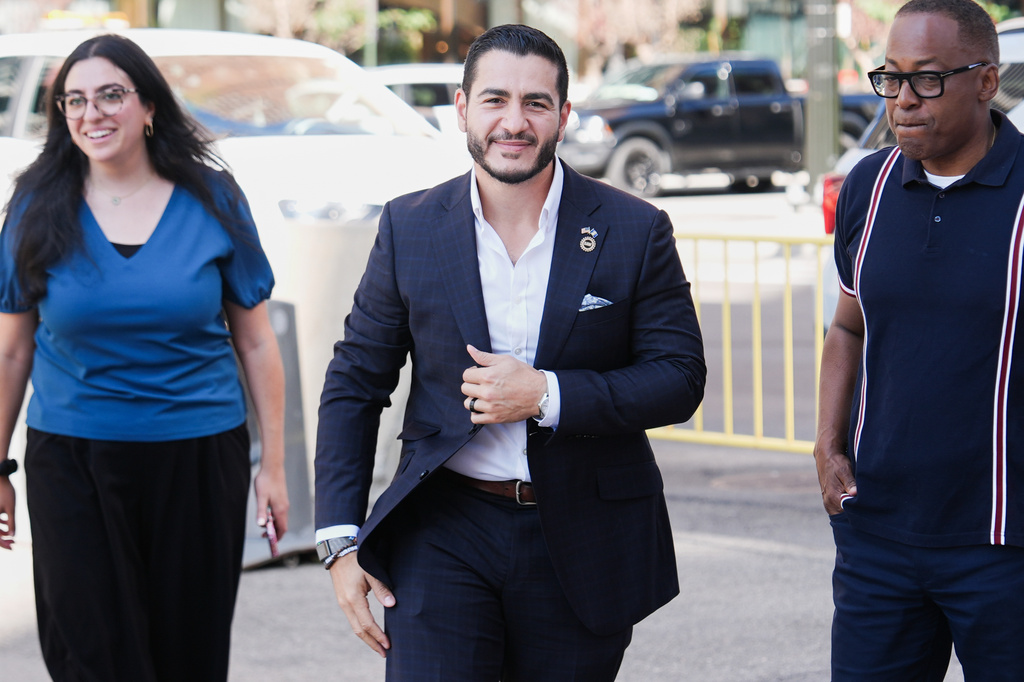 FILE - Abdul El-Sayed, center, arrives for a news conference at the Spirit of Detroit shortly after winning the Democratic nomination for U.S. Senate in Michigan, Aug. 5, 2026, in Detroit. (AP Photo/Julia Demaree Nikhinson, File)