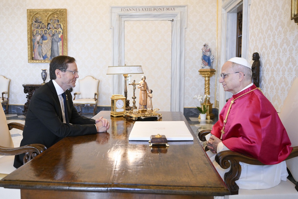 Israel's President Isaac Herzog, left, meets with Pope Leo XIV in the pope's private library during a private audience at the Vatican, Thursday, Sep. 4, 2025. (Simone Risoluti/Vatican Media via AP)