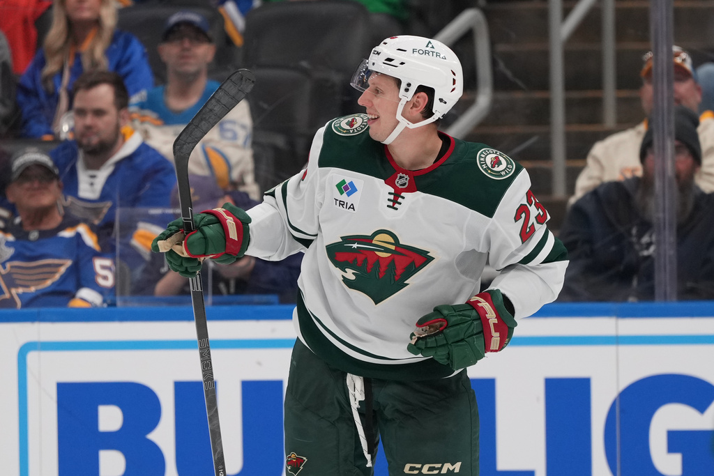 Minnesota Wild's Marco Rossi (23) celebrates after scoring during the third period of an NHL hockey game against the St. Louis Blues Thursday, Oct. 9, 2025, in St. Louis. (AP Photo/Jeff Roberson)