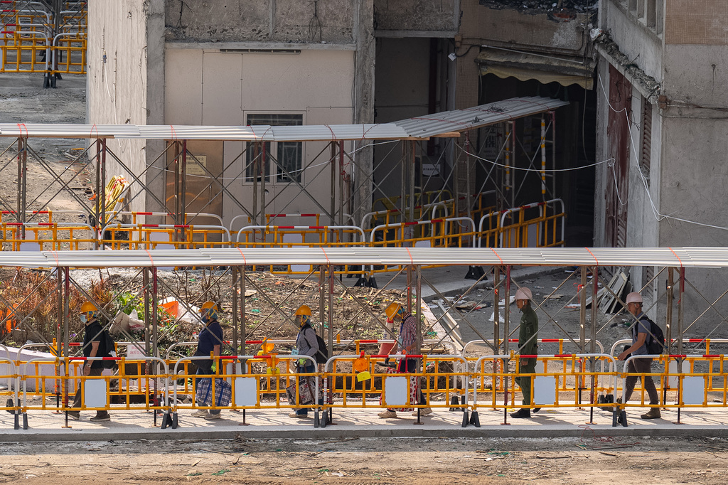 Residents of Wang Fuk Court return to their flats and retrieve belongings five months after the deadly fire in Hong Kong Monday, April 20, 2026. (AP Photo/ Chan Long Hei)
