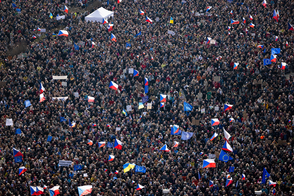 People gather to take part in a large anti-government protest in Prague, Czech Republic, Saturday, March 21, 2026. (AP Photo/Michal Turek)