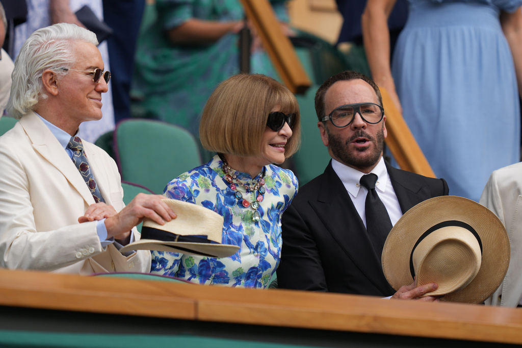 Fashion editor Anna Wintour, centre, film director Baz Luhrmann, left and fashion designer Tom Ford watch the Arthur Fery of Britain against Alexander Zverev of Germany men's singles semifinal match from the Royal Box on Centre Court at the Wimbledon Tennis Championships in London, Friday, July 10, 2026. (AP Photo/Kirsty Wigglesworth)