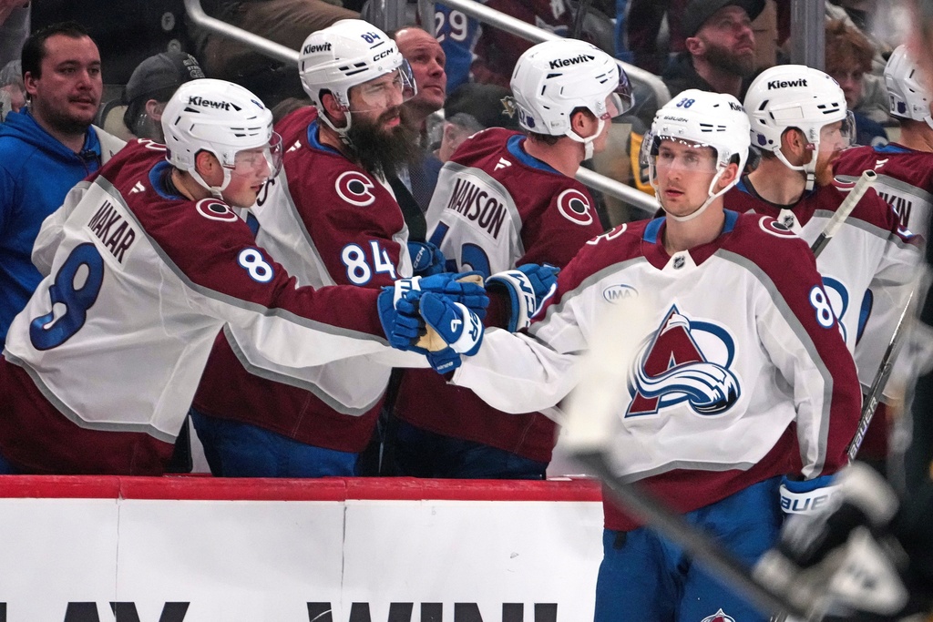 Colorado Avalanche's Martin Necas (88) returns to the bench after scoring during the second period of an NHL hockey game against the Pittsburgh Penguins in Pittsburgh, Tuesday, March 24, 2026. (AP Photo/Gene J. Puskar)