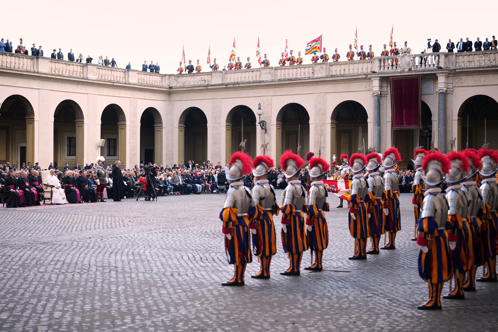 Pope Leo XIV attends the swearing in ceremony of 27 Pontifical Swiss Guards cadets in the St. Damasus Courtyard at the Vatican, Saturday, Oct. 4, 2025. (AP Photo/Andrew Medichini)