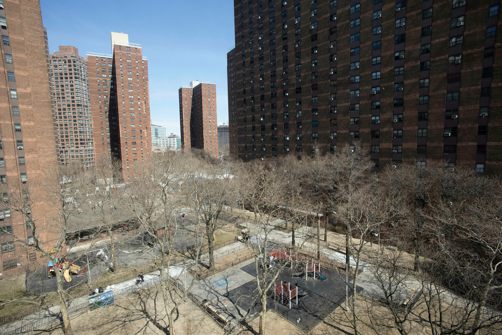 FILE - The New York City Housing Authority's John Haynes Holmes Towers are seen on April 4, 2019, in New York. (AP Photo/Mark Lennihan, File)