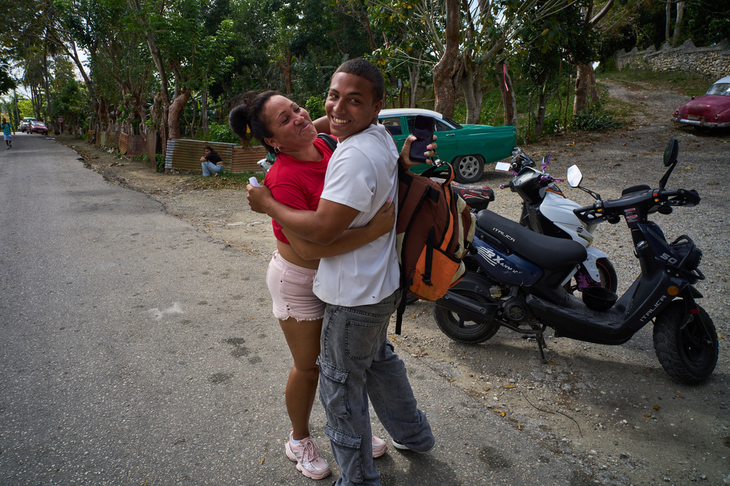Emilio Alejandro Leyva, a pardoned prisoner, right, hugs his mother Katia Arias Mendoza after his release from La Lima penitentiary in Guanabacoa, Havana, Cuba, Friday, April 3, 2026. (AP Photo/Ramon Espinosa)