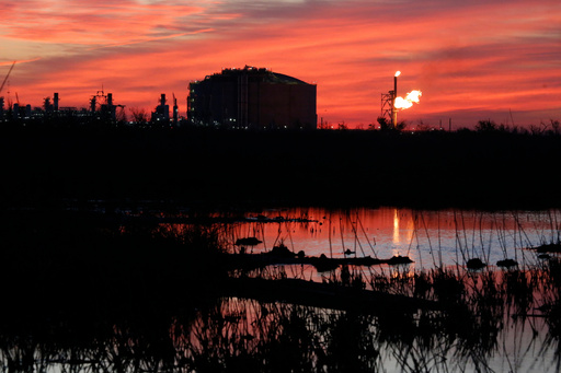 FILE - A flare burns at Venture Global LNG in Cameron, La., April 21, 2022. (AP Photo/Martha Irvine, File) FILE - A flare burns at Venture Global LNG in Cameron, La., April 21, 2022. (AP Photo/Martha Irvine, File)