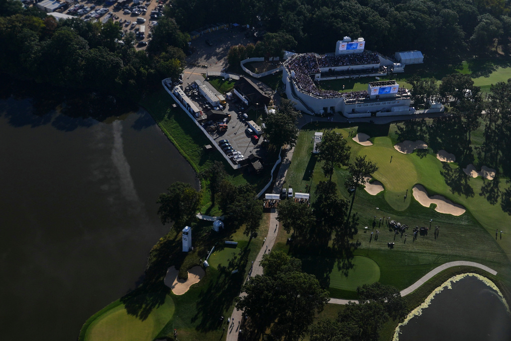 Air Force One, with President Donald Trump on board, flies over the Presidents Cup golf tournament at Medinah Country Club, Sunday, Sept. 27, 2026, in Medinah, Ill. (AP Photo/Julia Demaree Nikhinson)