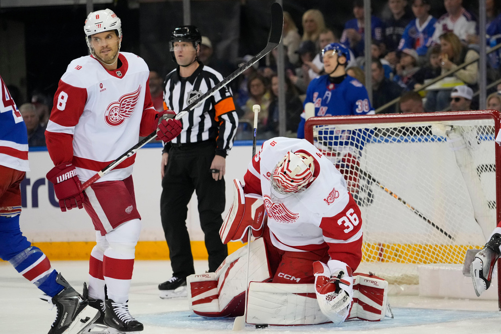 Detroit Red Wings goaltender John Gibson (36) covers the puck during the first period of an NHL hockey game against New York Rangers, Saturday, April 4, 2026, in New York. (AP Photo/Yuki Iwamura)