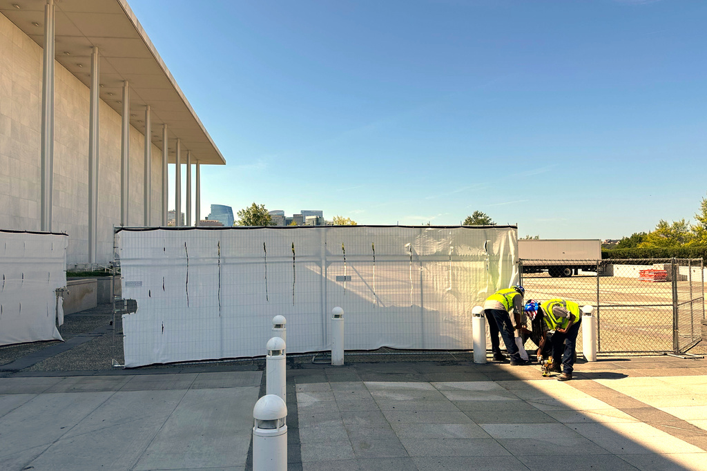 Fencing is placed outside the John F. Kennedy Center for the Performing Arts on Wednesday, Sept. 16, 2026, in Washington. (AP Photo/Nathan Ellgren)