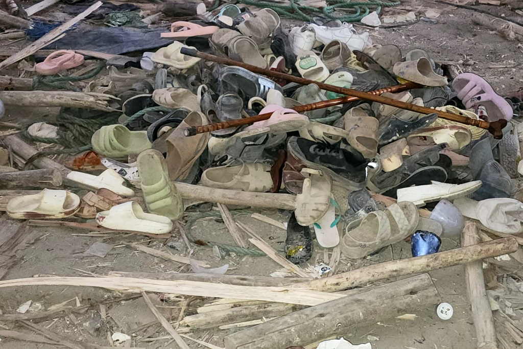 Shoes scattered on the floor inside the Menjar Shenkora Arerti Mariam Church under construction that collapsed in Arerti, Amhara region of northern Ethiopia, on Wednesday, Oct. 1, 2025. (AP Photo/Samuel Getachew)