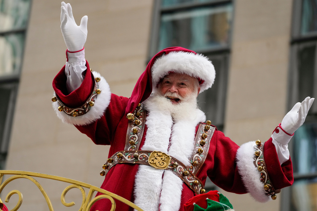 Macy's Santa Claus reacts as he rides on Santa's Sleigh during the Macy's Thanksgiving Day Parade, Thursday, Nov. 27, 2025, in New York. (AP Photo/Eduardo Munoz Alvarez)