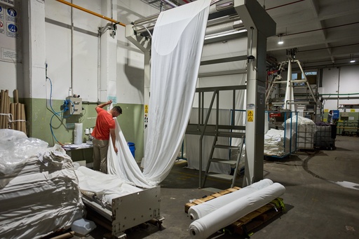 German Flores measures fabric at the Galfione Group textile factory in Buenos Aires, Argentina, Monday, Oct. 13, 2025. (AP Photo/Rodrigo Abd) German Flores measures fabric at the Galfione Group textile factory in Buenos Aires, Argentina, Monday, Oct. 13, 2025. (AP Photo/Rodrigo Abd)
