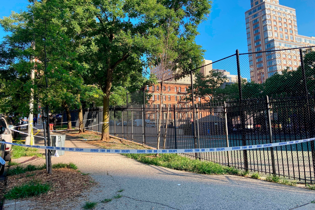 FILE - Crime scene tape surrounds the area on New York's Upper East Side, June 30, 2022, where police say a woman was fatally shot while she pushed her infant daughter in a stroller. (AP Photo/Jennifer Peltz, File)