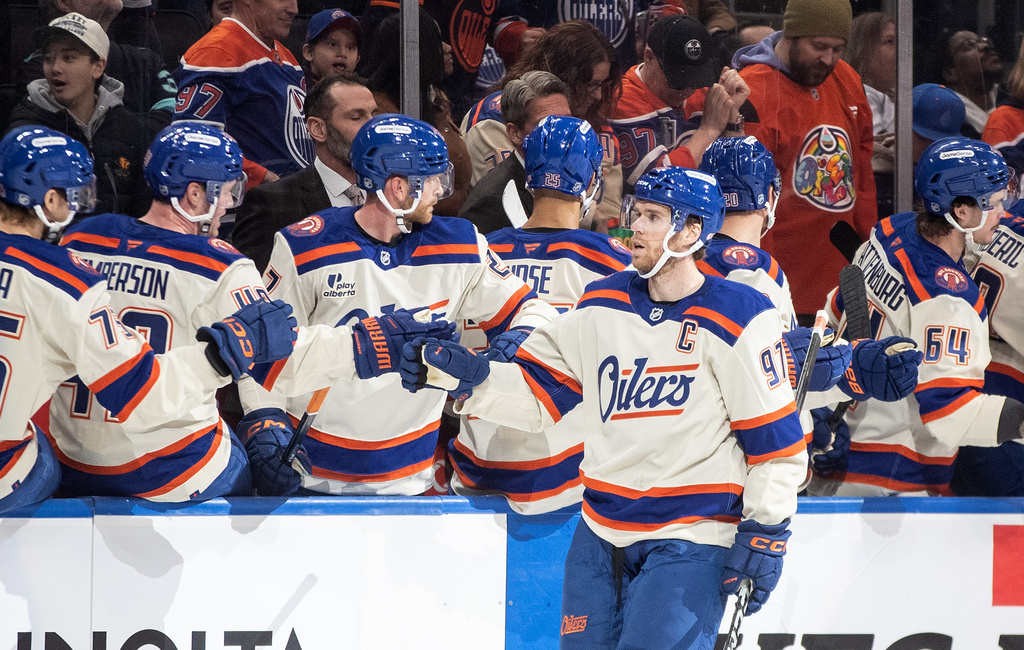 Edmonton Oilers' Connor McDavid (97) celebrates after a goal against the Seattle Kraken during first-period NHL hockey game action in Edmonton, Alberta, Thursday, Dec. 4, 2025. (Jason Franson/The Canadian Press via AP)