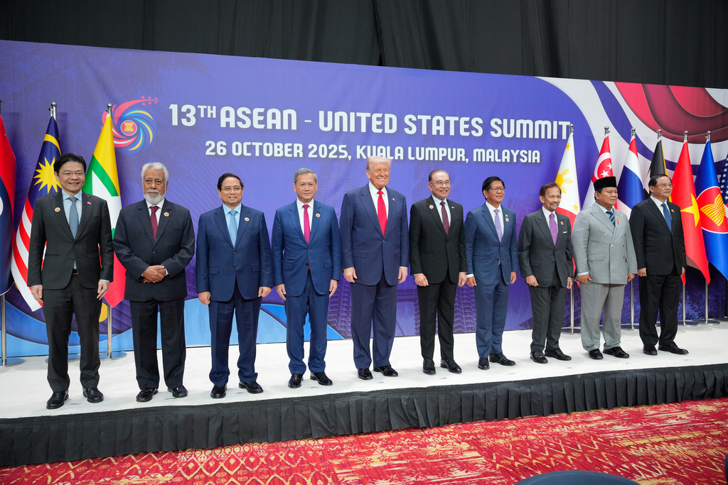 President Donald Trump, centre left, poses with other leaders during the ASEAN US Summit in Kuala Lumpur, Malaysia, Sunday, Oct. 26, 2025. (AP Photo/Vincent Thian, Pool)