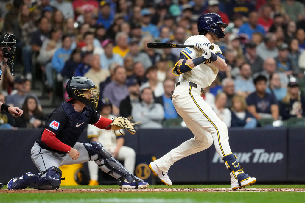 Milwaukee Brewers' Christian Yelich hits an RBI single during the second inning of a baseball game against the Cleveland Guardians, Wednesday, June 17, 2026, in Milwaukee. (AP Photo/Aaron Gash)