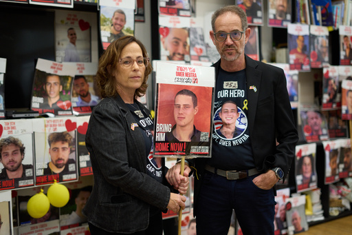 Ronen and Orna Neutra, parents of Omer Neutra, a U.S.-Israeli citizen who was killed in the Hamas-led attacks on Oct. 7, 2023, present a photo of their son in Tel Aviv, Israel, Monday, Oct. 27, 2025. (AP Photo/Ariel Schalit) Ronen and Orna Neutra, parents of Omer Neutra, a U.S.-Israeli citizen who was killed in the Hamas-led attacks on Oct. 7, 2023, present a photo of their son in Tel Aviv, Israel, Monday, Oct. 27, 2025. (AP Photo/Ariel Schalit)