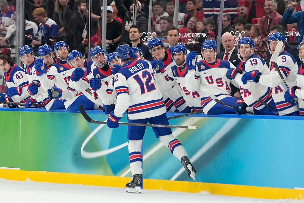 United States' Matt Boldy celebrates with teammates after scoring the opening goal during a men's ice hockey gold medal game between Canada and the United States at the 2026 Winter Olympics, in Milan, Italy, Sunday, Feb. 22, 2026. (AP Photo/Hassan Ammar)