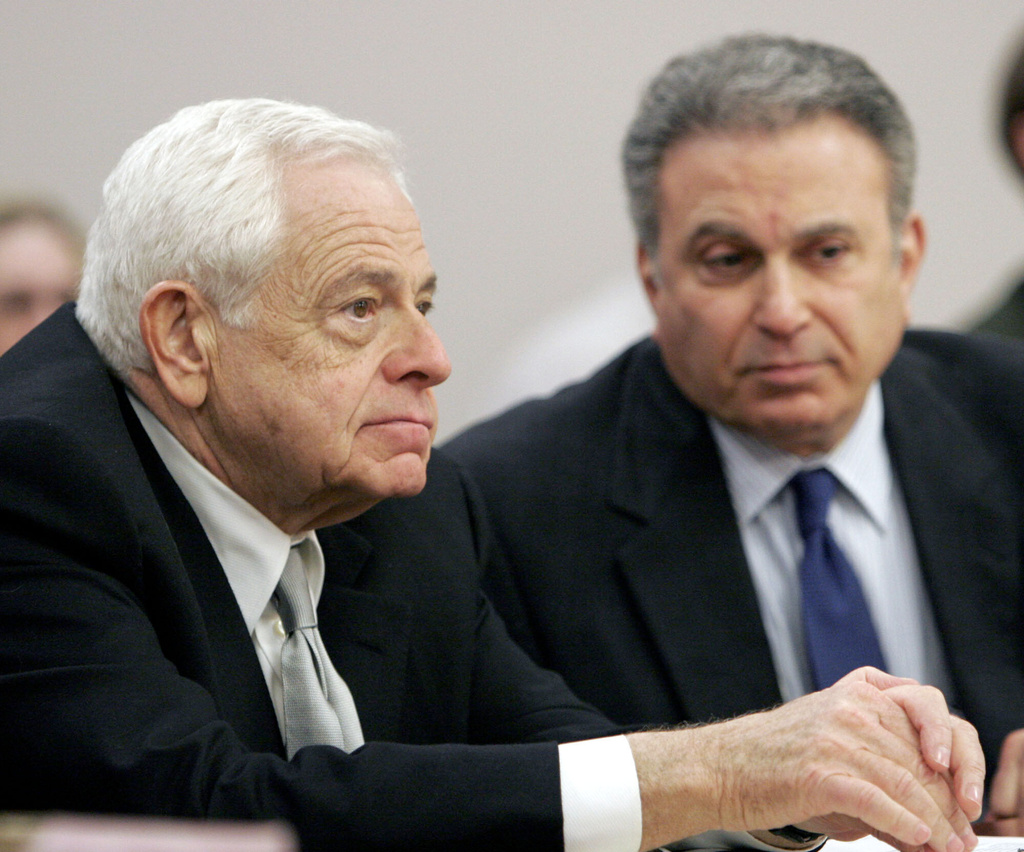 FILE - Plaintiff attorneys Stan Chesley, left, and Robert Steinberg, right, listen to witnesses during a hearing about the amount of the attorneys fees in the $85 million settlement between victims of sexual abuse and the Diocese of Covington Kentucky in Boone County Circuit Court, Tuesday, March 14, 2006 in Burlington, Kentucky. (AP Photo/David Kohl, file)
