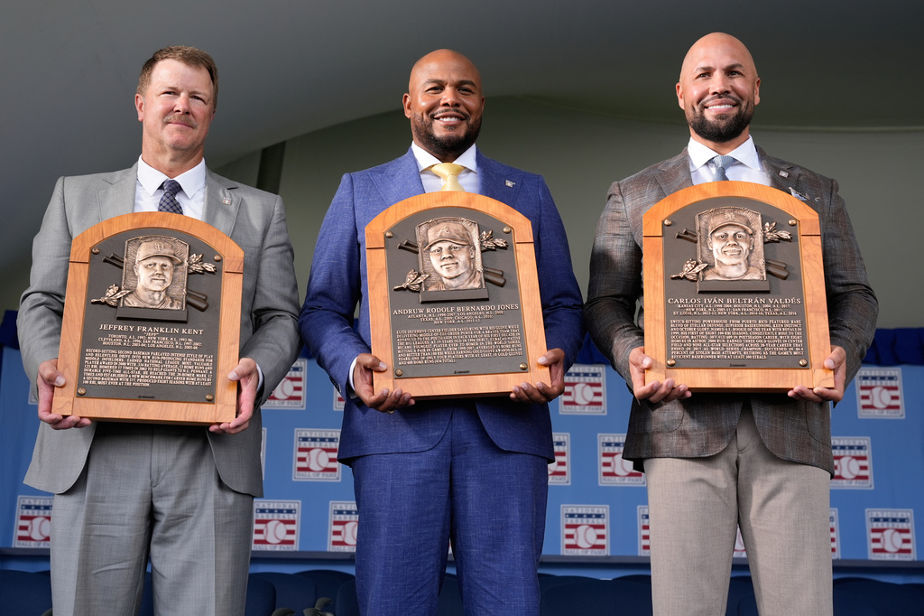 The 2026 Baseball Hall of Fame inductees Jeff Kent, left, Andruw Jones, center, and Carlos Beltran pose for pictures after the induction ceremony in Cooperstown, N.Y., Sunday, July 26, 2026. (AP Photo/Seth Wenig)