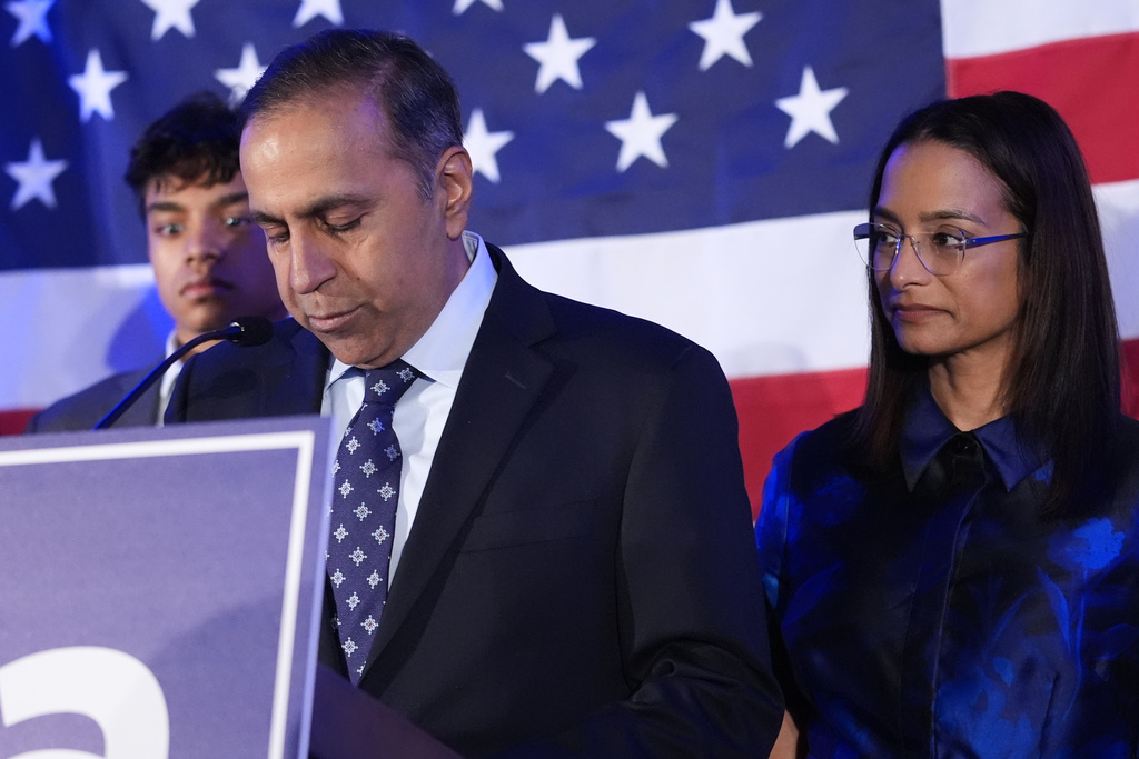 U.S. Rep. Raja Krishnamoorthi, D-Ill., center, concedes as his wife, Priya Bala, looks on during an election night watch party after losing the Democratic primary for U.S. Senate, Tuesday, March 17, 2026, in Chicago. (AP Photo/Nam Y. Huh)