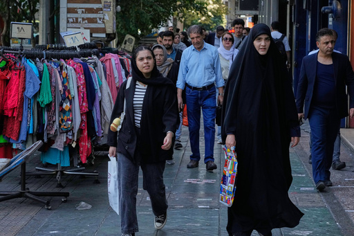 People walk on a sidewalk at the Enqelab-e-Eslami (Islamic Revolution) street, in Tehran, Iran, Saturday, Sept. 27, 2025. (AP Photo/Vahid Salemi) People walk on a sidewalk at the Enqelab-e-Eslami (Islamic Revolution) street, in Tehran, Iran, Saturday, Sept. 27, 2025. (AP Photo/Vahid Salemi)