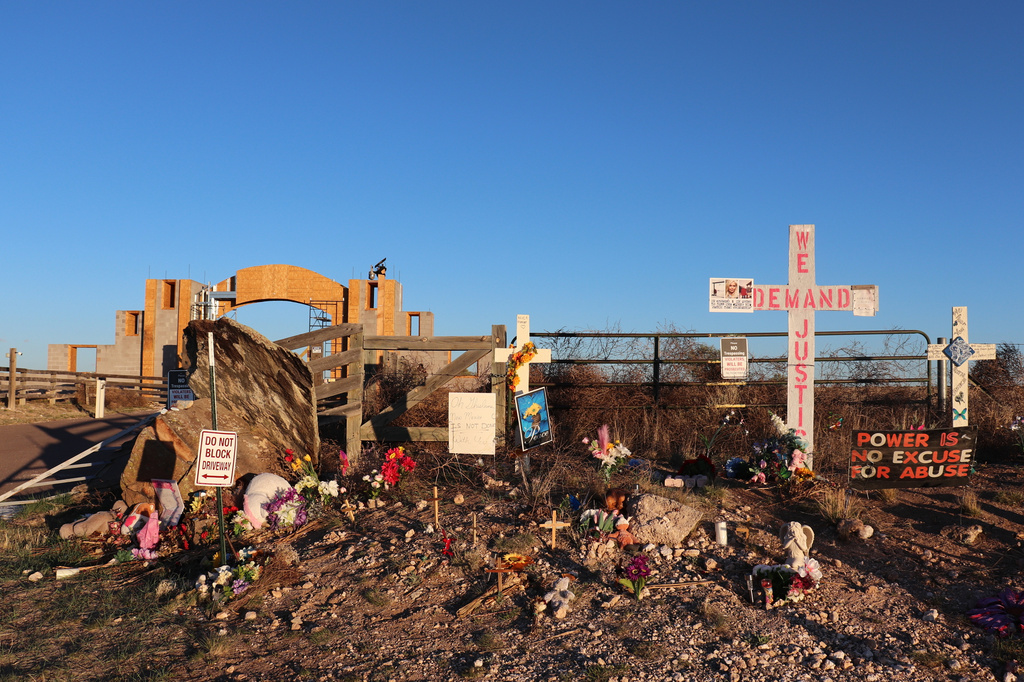 Crosses, flowers and other mementos are displayed outside Jeffrey Epstein's former Zorro Ranch near Stanley, N.M., on Friday April 3, 2026. (AP Photo/Savannah Peters)