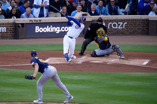 Chicago Cubs' Michael Busch hirts a home run during the first inning of Game 3 of baseball's National League Division Series against the Milwaukee Brewers Wednesday, Oct. 8, 2025, in Chicago. (AP Photo/Nam Huh) Chicago Cubs' Michael Busch hirts a home run during the first inning of Game 3 of baseball's National League Division Series against the Milwaukee Brewers Wednesday, Oct. 8, 2025, in Chicago. (AP Photo/Nam Huh)