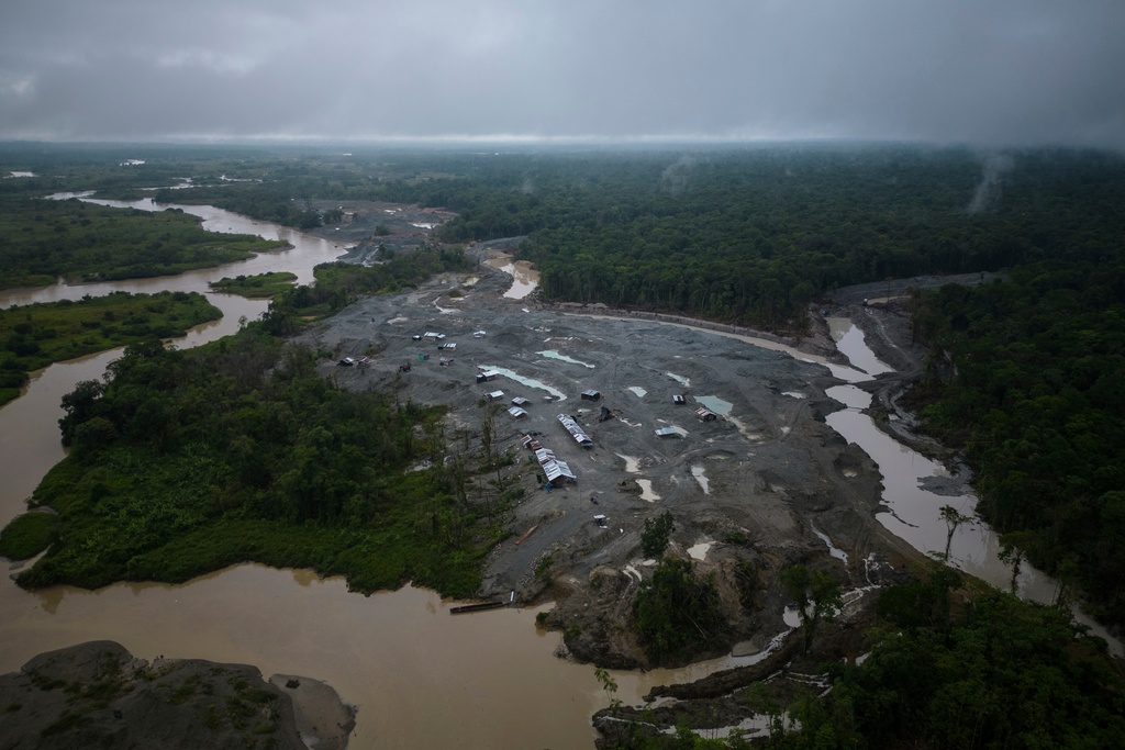 FILE - An illegal mining camp, sits along the Quito River, the Atrato River's main tributary, near Paimado, Colombia, Sept. 23, 2024. (AP Photo/Ivan Valencia, File)