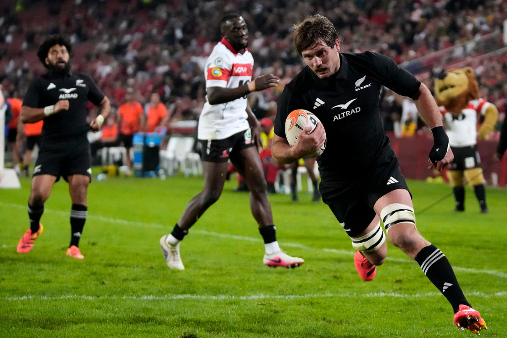 New Zealand's Ethan Blackadder scores a try during an international friendly rugby match between Lions and New Zealand, in Johannesburg, South Africa, Tuesday, Aug. 25, 2026. (AP Photo/Themba Hadebe)